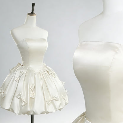 white strapless satin bubble short dress with handmade satin bows, front and closeup view